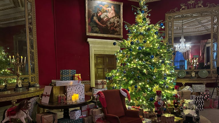 Christmas tree sparkling in red upholstered room